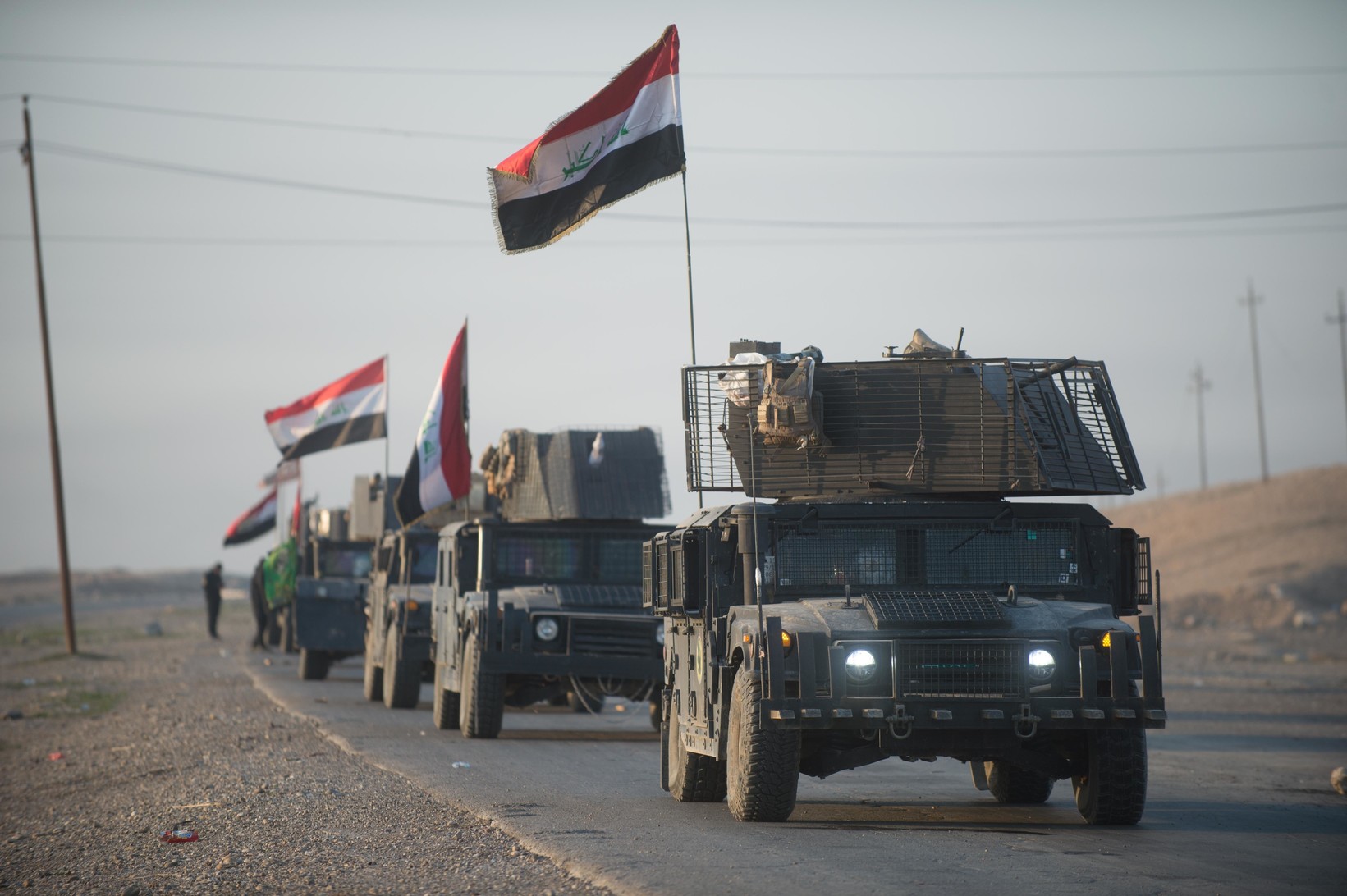 An Iraqi counterterrorism service convoy moves from Baghdad toward Mosul, Iraq, Feb. 23, 2017. Army photo by Staff Sgt. Alex Manne. Baghdad, 2017. (CC-0)(The appearance of U.S. Department of Defense (DoD) visual information does not imply or constitute DoD endorsement.) An Iraqi counterterrorism service convoy moves from Baghdad toward Mosul, Iraq, Feb. 23, 2017. Army photo by Staff Sgt. Alex Manne. Baghdad, 2017. (CC-0)(The appearance of U.S. Department of Defense (DoD) visual information does not imply or constitute DoD endorsement.)