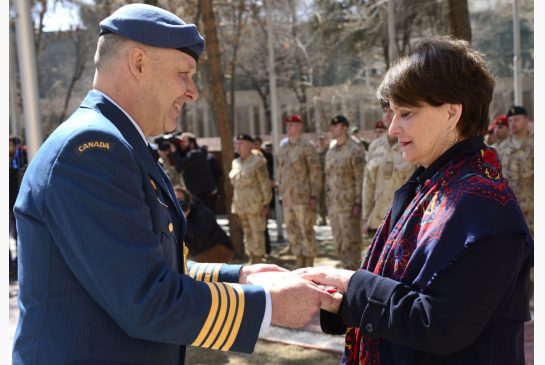 Canadian Ambassador to Afghanistan Deborah Lyons, shown being handed the flag by Col. Robert Spencer in March, 2014, says it's “a tremendous opportunity for Canada to have an ambassador who is committed to working on women’s issues.” Image by MCPL PATRICK BLANCHARD / THE CANADIAN FORCES. Media file: deborah-lyons2.jpg.size_.xxlarge.letterbox.jpg