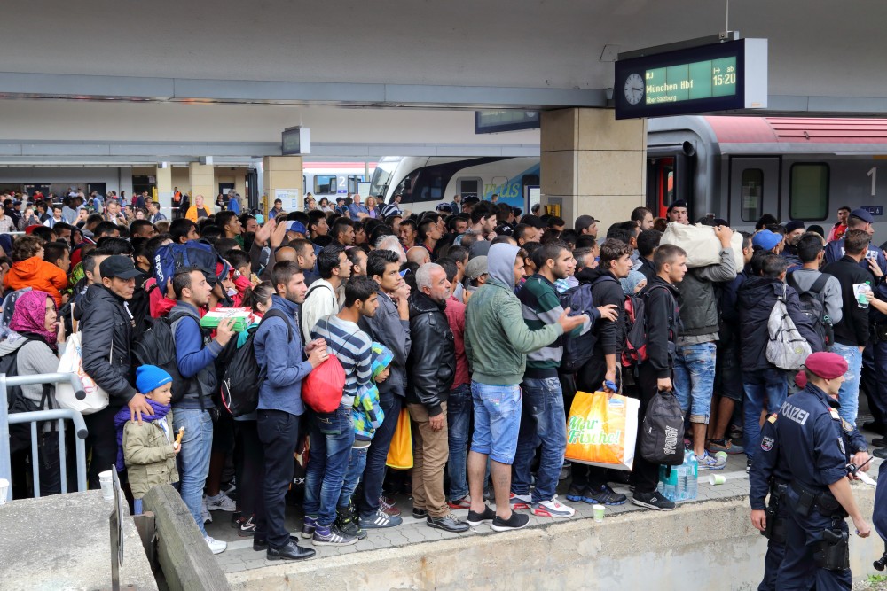 Migrants at Wien Westbahnhof railway station on their way to Germany. Image by Bwag courtesy Wikimedia Commons. Austria, 2015. Migrants at Wien Westbahnhof railway station on their way to Germany. Image by Bwag courtesy Wikimedia Commons. Austria, 2015.