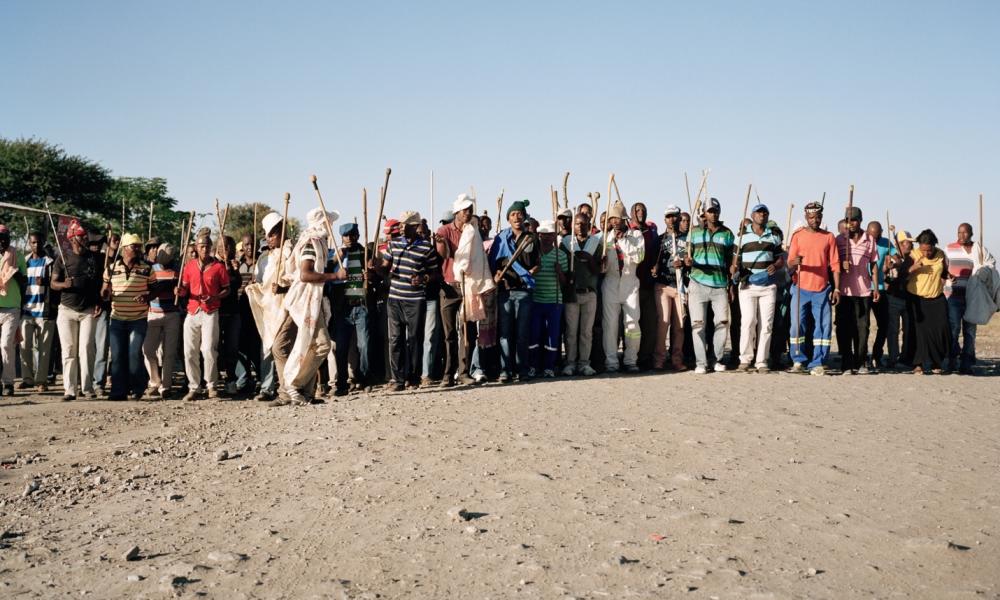 Striking platinum mine workers march together in Marikana, near to the site of 2012’s massacre. Image by Jason Larkin. South Africa, 2014. Media file: south_africa.jpg