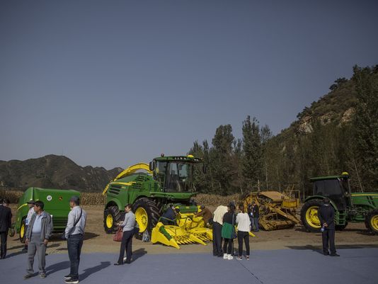 John Deere implements on display during the groundbreaking ceremony for the China-US Demonstration Farm in Luanping County, Hebei. Image by Kelsey Kremer. China, 2017. John Deere implements on display during the groundbreaking ceremony for the China-US Demonstration Farm on Saturday, Sept. 23, 2017, in Luanping County, Hebei, China. Image by Kelsey Kremer. China, 2017.