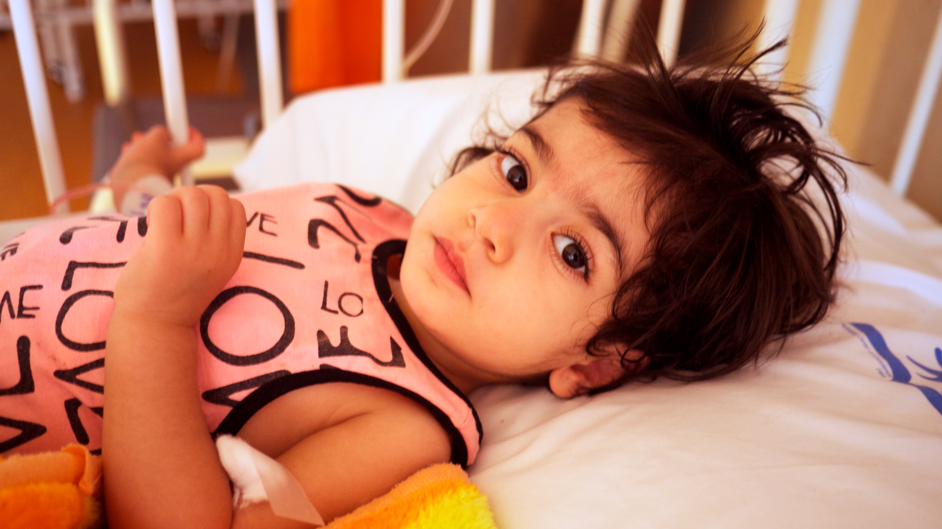 Ava, 2, had the holes in her heart mended during the first week of the medical mission. She was discharged from the ICU one day after surgery. Image by Farzana Shah. Iran, 2015.