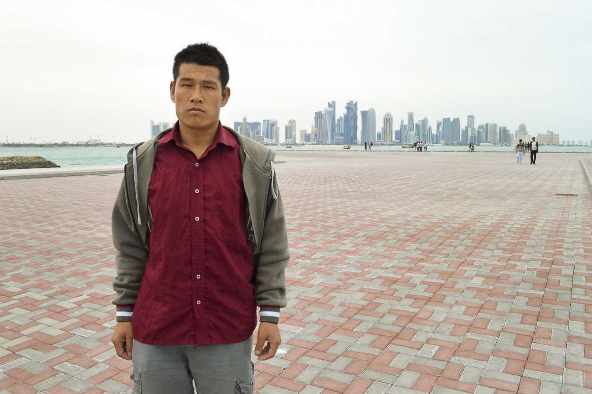 Tirtha Raj Tamang, a Nepalese migrant worker, says he was exploited by a Nepalese company that sent him to work in Qatar. He was photographed in Doha, Qatar's capital city. Image by Shilu Manandhar. Qatar, 2016. Tirtha Raj Tamang, a Nepalese migrant worker, says he was exploited by a Nepalese company that sent him to work in Qatar. He was photographed in Doha, Qatar's capital city. Image by Shilu Manandhar. Qatar, 2016.