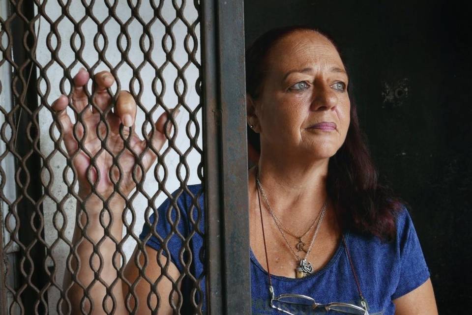 Cuban migrant Rita María Triana at the entrance to a small apartment where she lives in Panama City. Image by Jose A. Iglesias. Panama, 2017. Cuban migrant Rita María Triana at the entrance to a small apartment where she lives in Panama City. Image by Jose A. Iglesias. Panama, 2017.