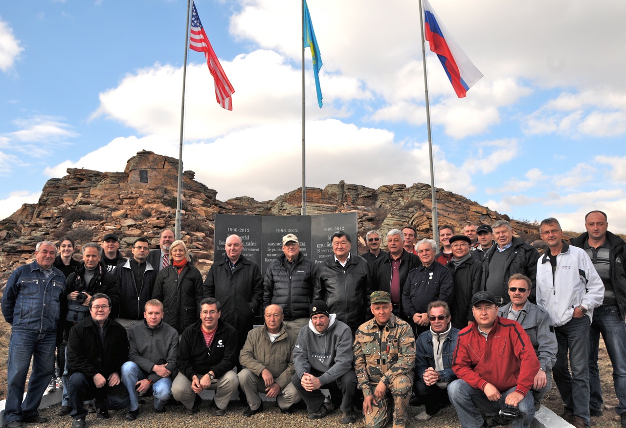 Scientists celebrate on top of the mountain. Image courtesy of US Department of Defense. Kazakhstan, 2013.