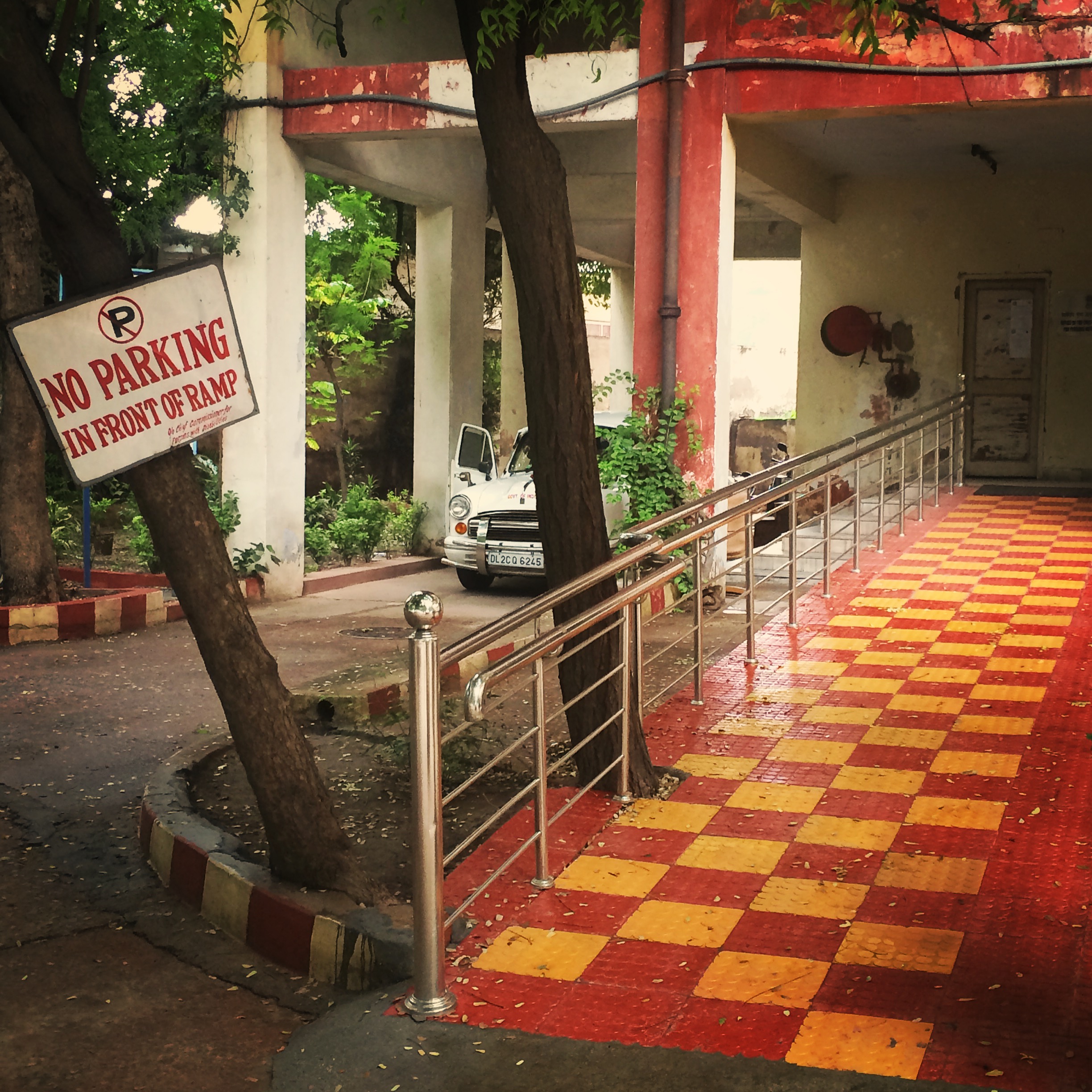 For persons with physical or sensory disabilities in India, accessibility in public spaces, education, and transportation is a daily challenge. One of the few well-designed wheelchair ramps (not the steep “rocket launchers,” as wheelchair users in India call them) is located outside the Office of the Chief Commissioner for Persons with Disabilities. Image by Kate Petcosky-Kulkarni. India, 2016. For persons with physical or sensory disabilities in India, accessibility in public spaces, education, and transportation is a daily challenge