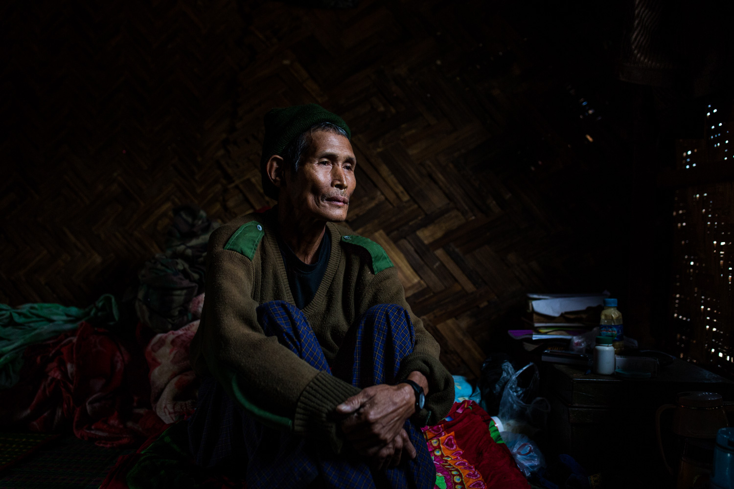 Dawng Hkawng, who was displaced by the Chipwi dam project in 2012, sits in his small room in the Chipwi internally displaced persons camp in Chipwi, Kachin State, Myanmar. Image by Hkun Lat. Myanmar, 2019. Dawng Hkawng, who was displaced by the Chipwi dam project in 2012, sits in his small room in the Chipwi internally displaced persons camp in Chipwi, Kachin State, Myanmar. Image by Hkun Lat. Myanmar, 2019.