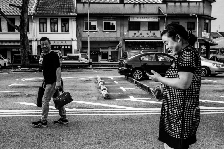 Mr. Cheng and Ms. Feng are on the way to the restaurant that offers free-meals to Chinese migrant workers. Image by Xyza Bacani. Singapore, 2017. Mr. Cheng and Ms. Feng are on the way to the restaurant that offers free-meals to Chinese migrant workers. Image by Xyza Bacani. Singapore, 2017.
