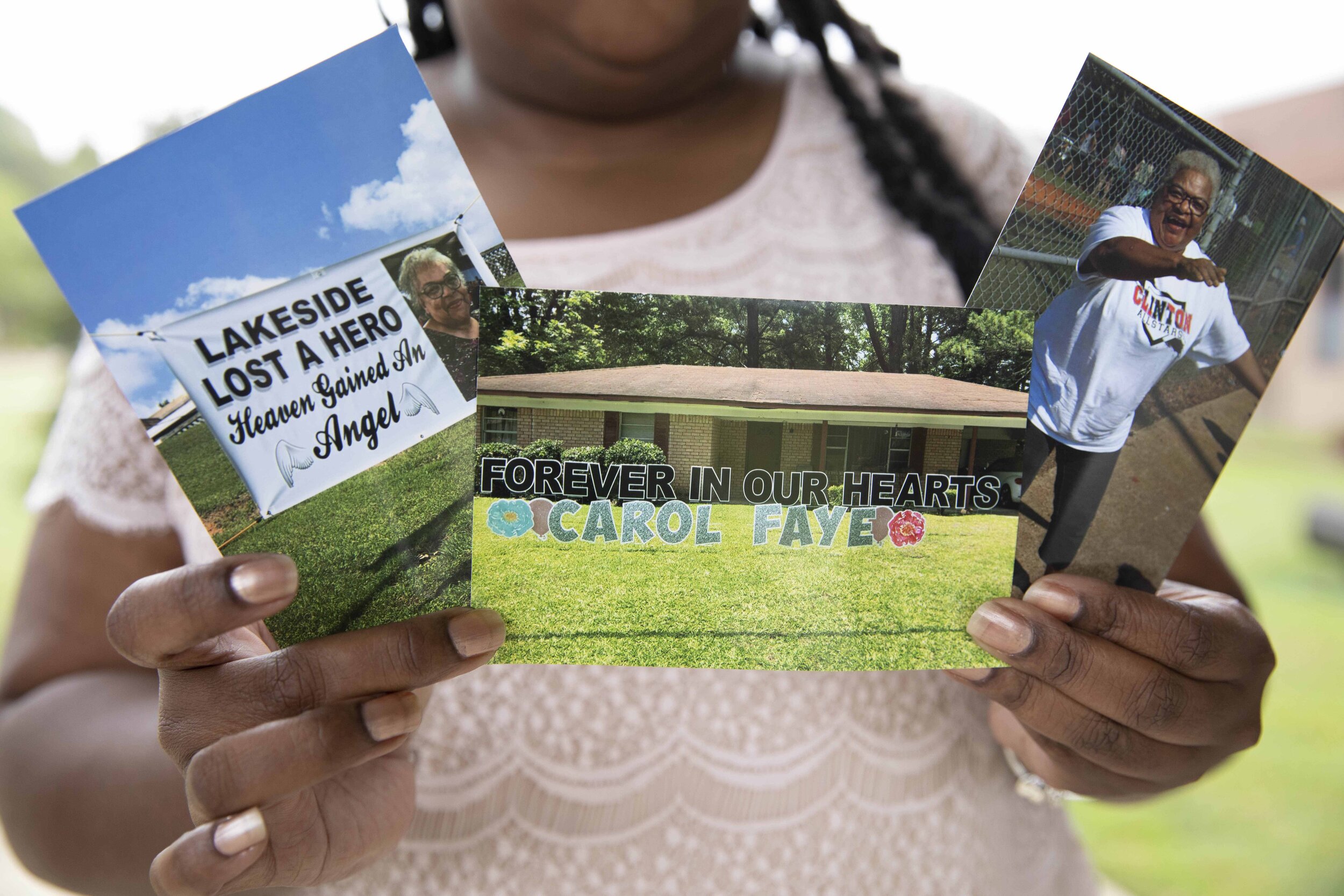 On September 25, 2020, in Bolton, MS, Shenika Jackson holds photos memorializing her late mother, Carol Faye Doby, who died from complications of COVID-19 earlier this year. Image by Sarah Warnock/MCIR. United States, 2020. Shenika Jackson holds photos memorializing her late mother, Carol Faye Doby, who died from complications of COVID-19 earlier this year. Friday, September 25, 2020 in Bolton, MS. Image by Sarah Warnock/MCIR. United States, 2020.