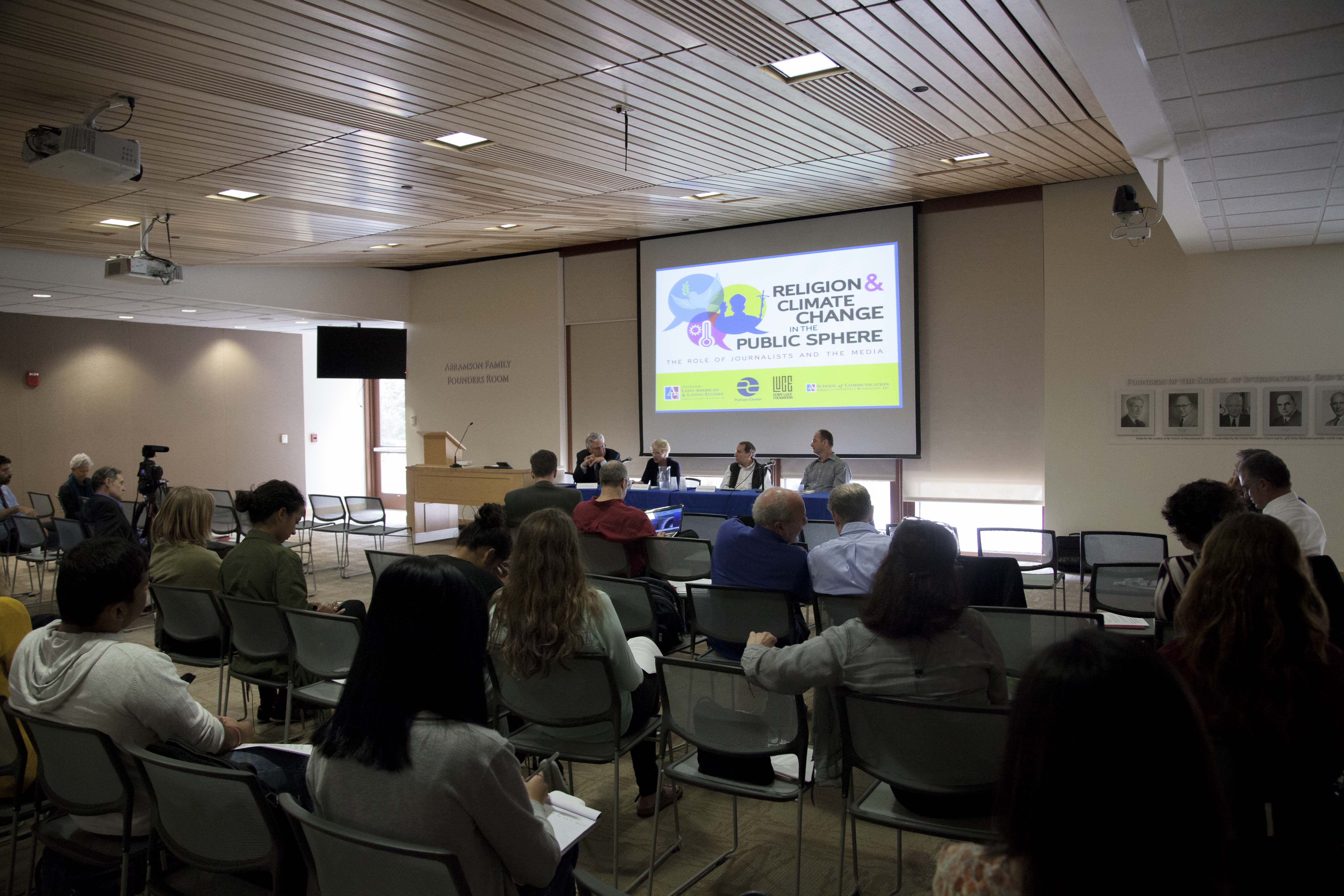 Panelists talk at American University's public forum. Image by Jin Ding. United States, 2015. Media file: _mg_8772.jpg