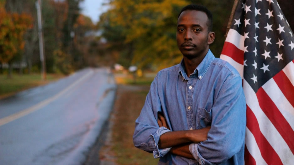 Abdi Nor Iftin in front of the U.S. flag. Image by Leo Hornak. United States, undated. Abdi Nor Iftin in front of the U.S. flag. Image by Leo Hornak. United States, undated.