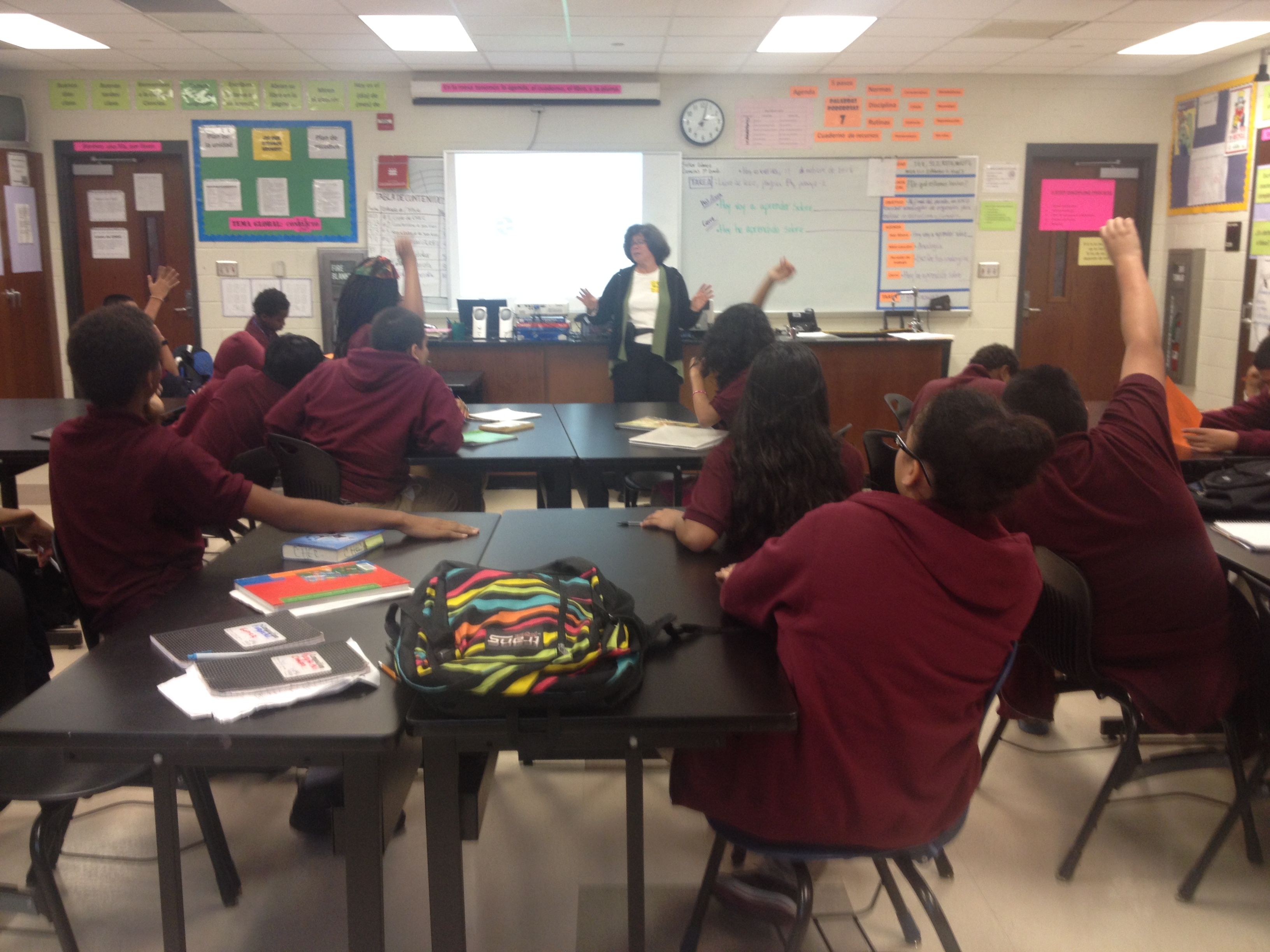 Joanne Silberner speaks with seventh-grade students at Lincoln Middle School, Columbia Heights Education Campus, during her tour of DC schools Friday, October 11. Image by Amanda Ottaway. Washington DC, 2013. Media file: silbernerschool.jpg