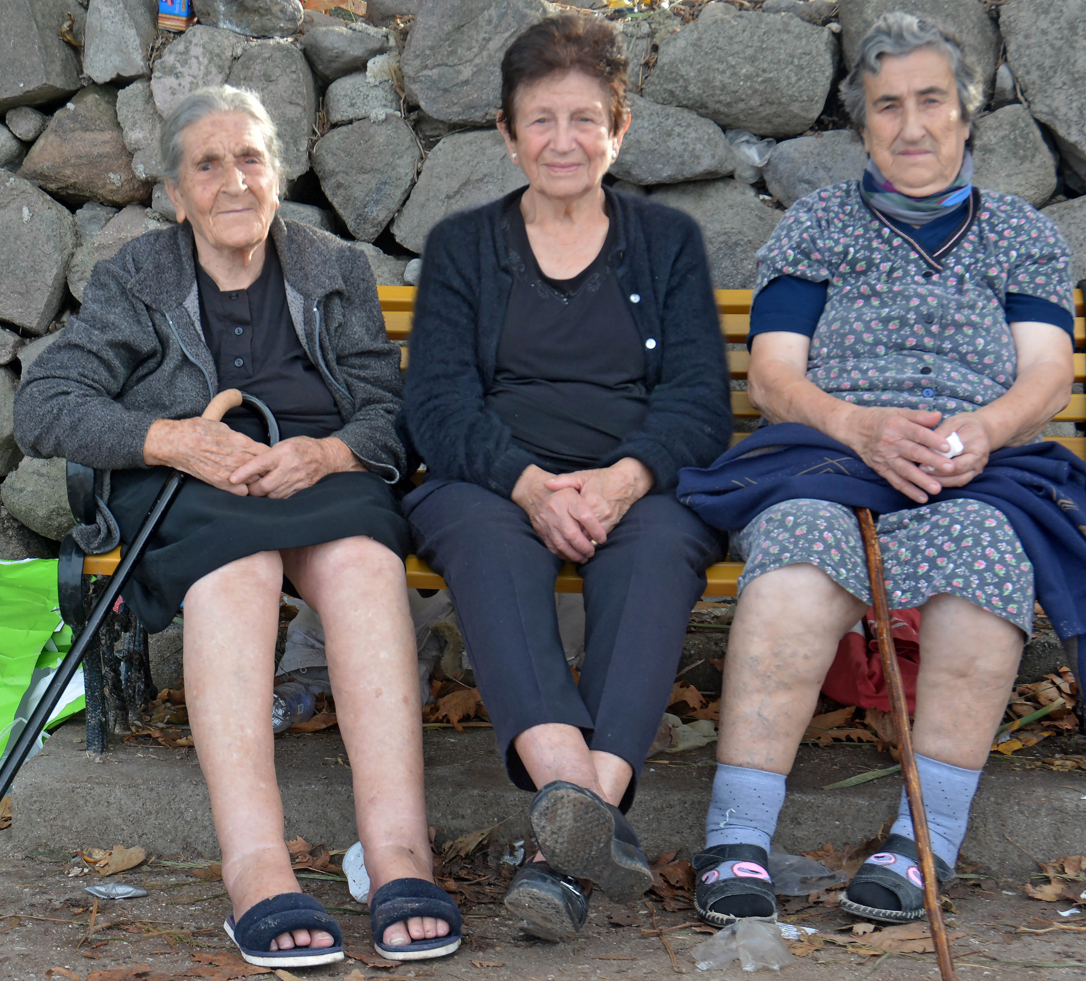 Constantina Mesisklis, center, and two friends at Skala Sykaminia in Lesbos, Greece. Image by Alison Terry-Evans. Greece, 2015.