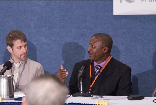 Filmmaker and Pulitzer Center grantee Rob Tinworth (left) listens as Uche Onyebadi discusses Campus Consortium program during a panel at the Pulitzer Center's 10th Anniversary Celebration, held in Washington, DC, on October 8, 2016. Onyebadi is chair of the Department of Journalism at Texas Christian University’s Bob Schieffer College of Communication. Image by Jin Ding. Washington, D.C., 2016 Media file: rob_and_uche.jpg