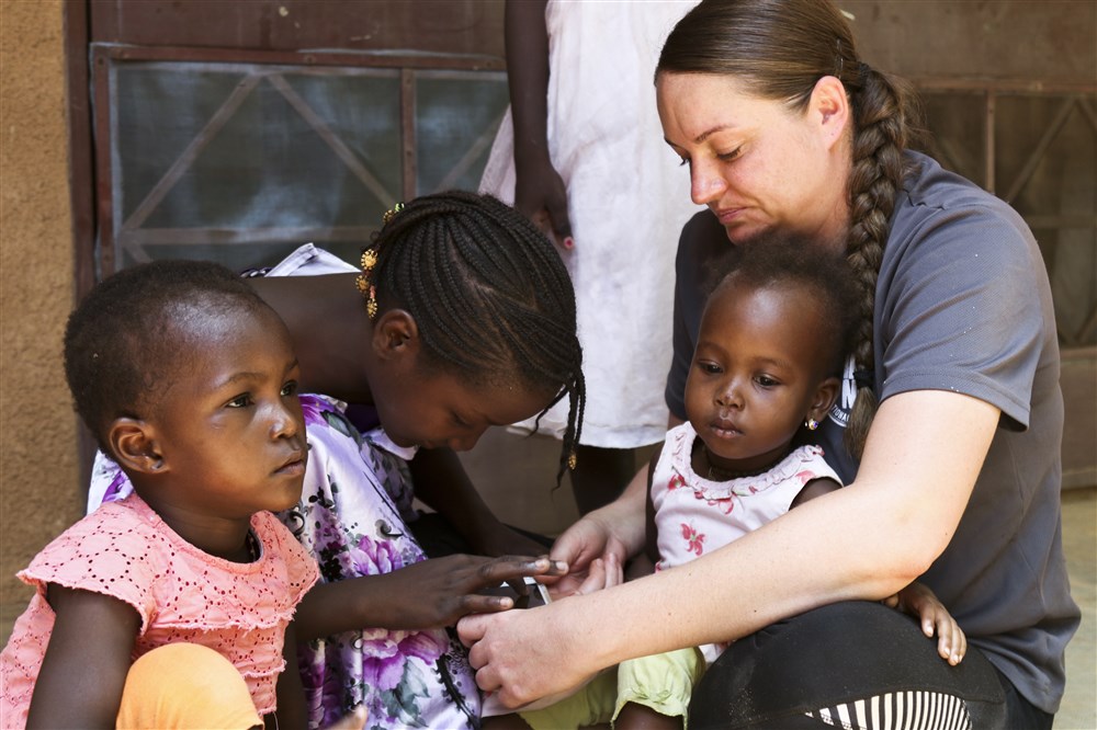 A U.S. military member interacts with orphans at Saint Vincent Orphanage of Niamey during Flintlock 2018 in Niamey, Niger. U.S. Army photo by Sgt. Heather Doppke/79th Theater Sustainment Command. Nigeria, 2018. A U.S. military member interacts with orphans at Saint Vincent Orphanage of Niamey during Flintlock 2018 in Niamey, Niger. U.S. Army photo by Sgt. Heather Doppke/79th Theater Sustainment Command. Nigeria, 2018.