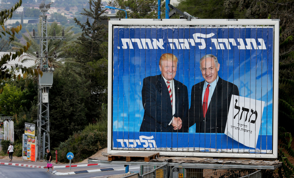 An Israeli election billboard for the Likud party showing President Donald Trump shaking hands with Israeli Prime Minister Benjamin Netanyahu in Beth Shemesh, Israel on September 8, 2019. Image by Gil Cohen Magen / Shutterstock. Israel, 2019. An Israeli election billboard for the Likud party showing President Donald Trump shaking hands with Israeli Prime Minister Benjamin Netanyahu in Beth Shemesh, Israel on September 8, 2019. Image by Gil Cohen Magen / Shutterstock. Israel, 2019.
