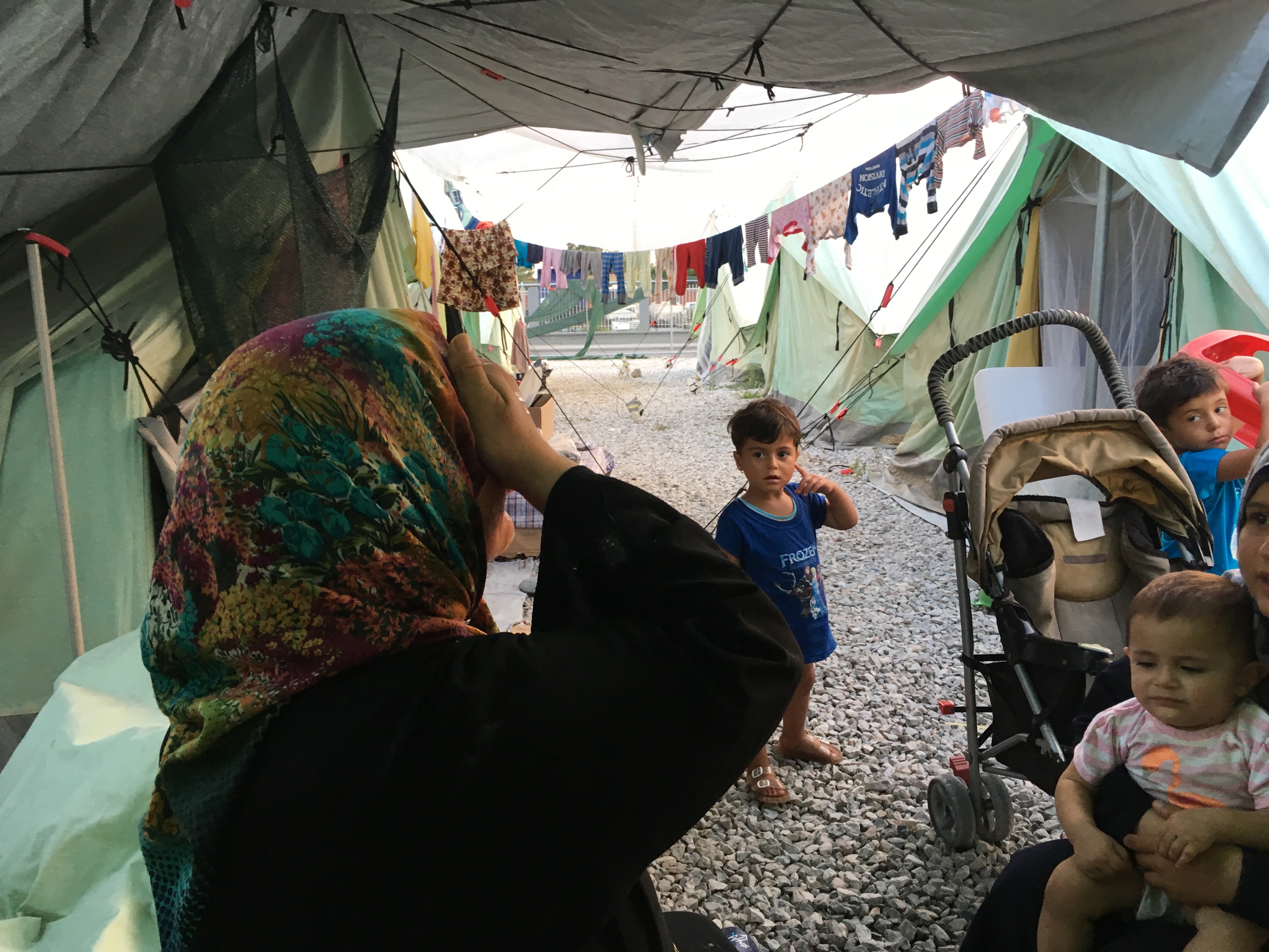 A woman and her children at Softex refugee camp in northern Greece. Image by Jeanne Carstensen. Greece, 2016. A woman and her children at Softex refugee camp in northern Greece. Image by Jeanne Carstensen. Greece, 2016.