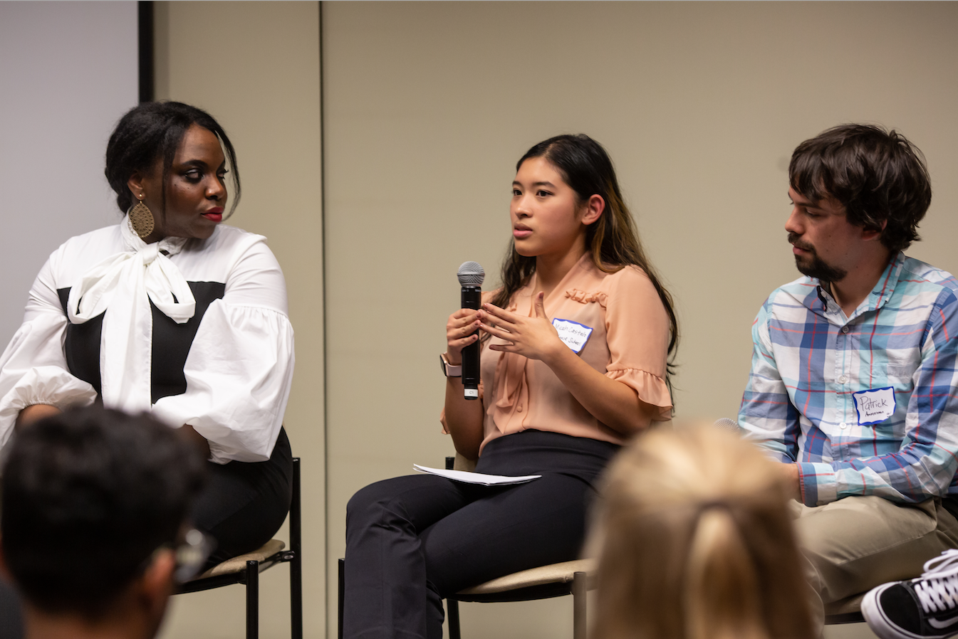 Micah Castelo (Syracuse University) responds to an audience question during the "Migration and Displacement" Q&A session on Day One of Washington Weekend. Castelo is joined onstage by fellow panelists Angelica Ekeke (Berkeley Graduate School of Journalism) and Patrick Ammerman (University of Pennsylvania). Image by Claire Seaton. United States, 2019. Micah Castelo (Syracuse University) responds to an audience question during the "Migration and Displacement" Q&A session on Day One of Washington Weekend. Castelo is joined onstage by fellow panelists Angelica Ekeke (Berkeley Graduate School of Journalism) and Patrick Ammerman (University of Pennsylvania). Image by Claire Seaton. United States, 2019.