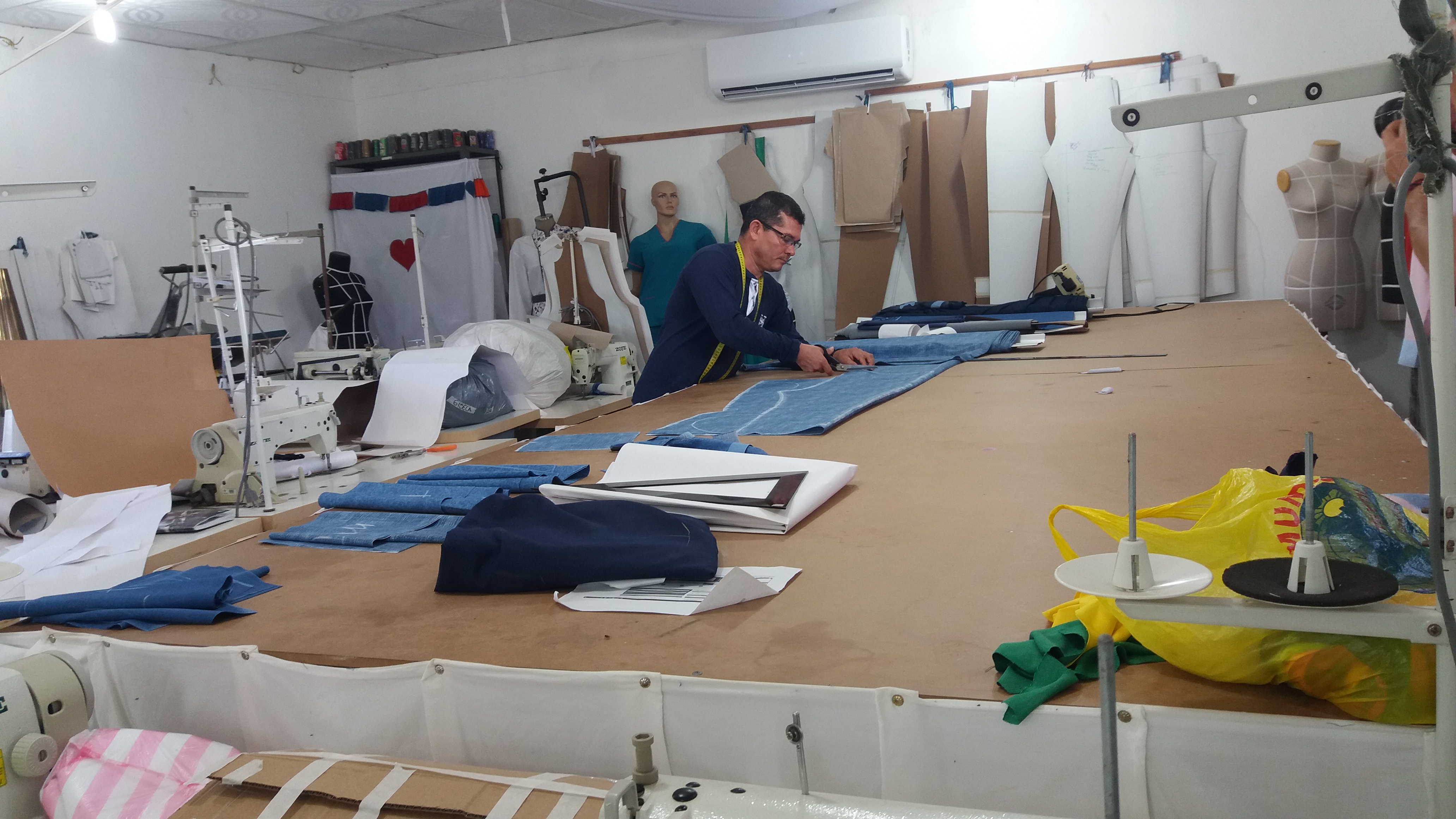 Diosenel Criado was a top tailor for the Farc in the jungle, carrying his sewing machine between camps on a donkey. Now he works from a workshop at the Farc camp in Pondores, La Guajira. Image by Laura Dixon. Colombia, 2018. Diosenel Criado was a top tailor for the Farc in the jungle, carrying his sewing machine between camps on a donkey. Now he works from a workshop at the Farc camp in Pondores, La Guajira. Image by Laura Dixon. Colombia, 2018.