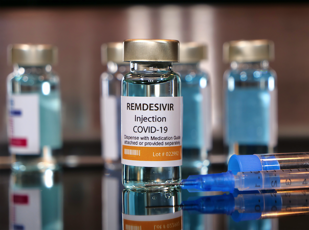 Vial of the drug remdesivir with syringe for COVID-19 treatment. Image by Bernard Chantal / Shutterstock. 2020. Vial of the drug remdesivir with syringe for COVID-19 treatment. Image by Bernard Chantal / Shutterstock. 2020.