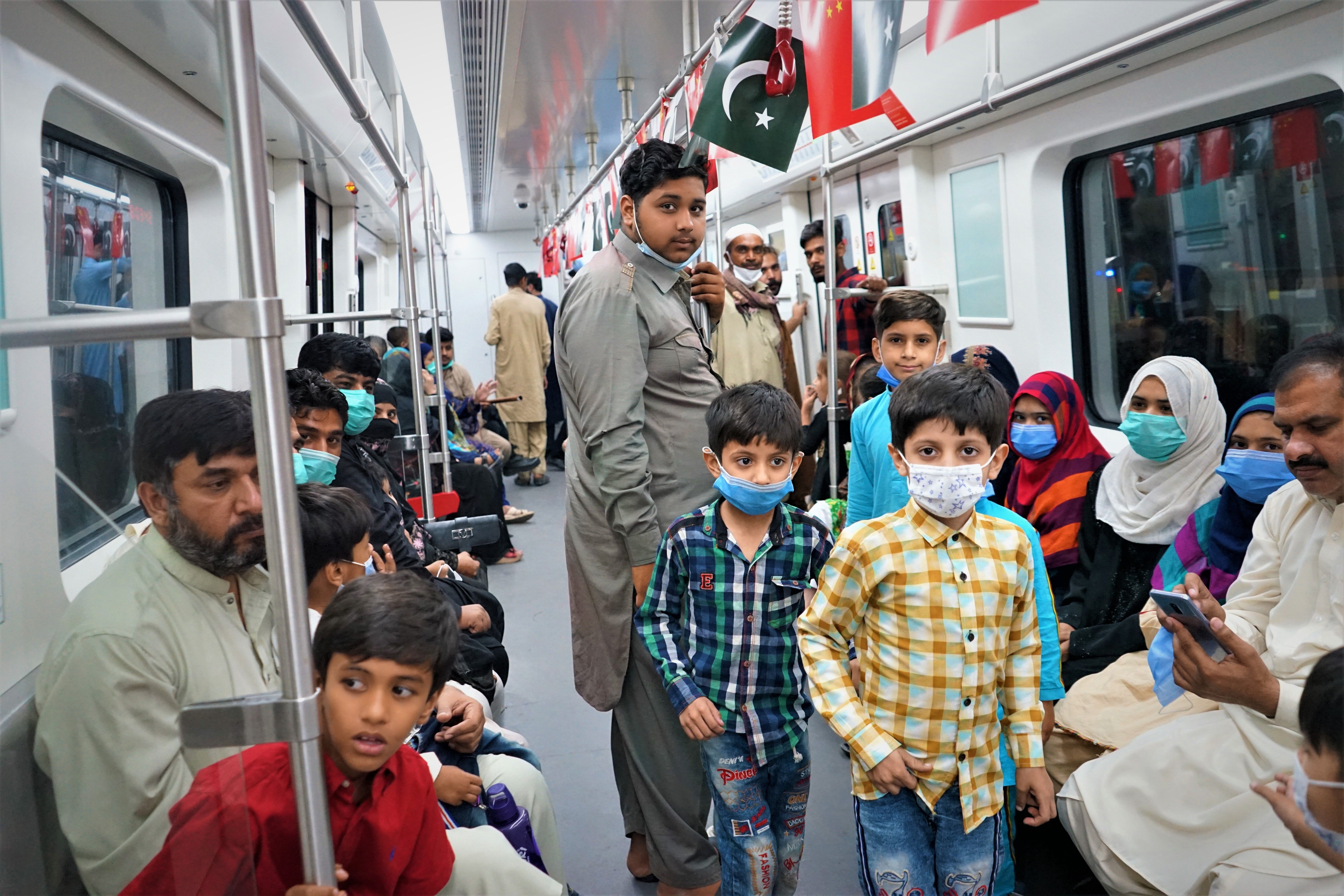 Lahoris riding the Orange Line for the first time. The railway will improve the lives of many in the city. Image by Sabrina Toppa. Pakistan, 2020. Lahoris riding the Orange Line for the first time. The railway will improve the lives of many in the city. Image by Sabrina Toppa. Pakistan, 2020.