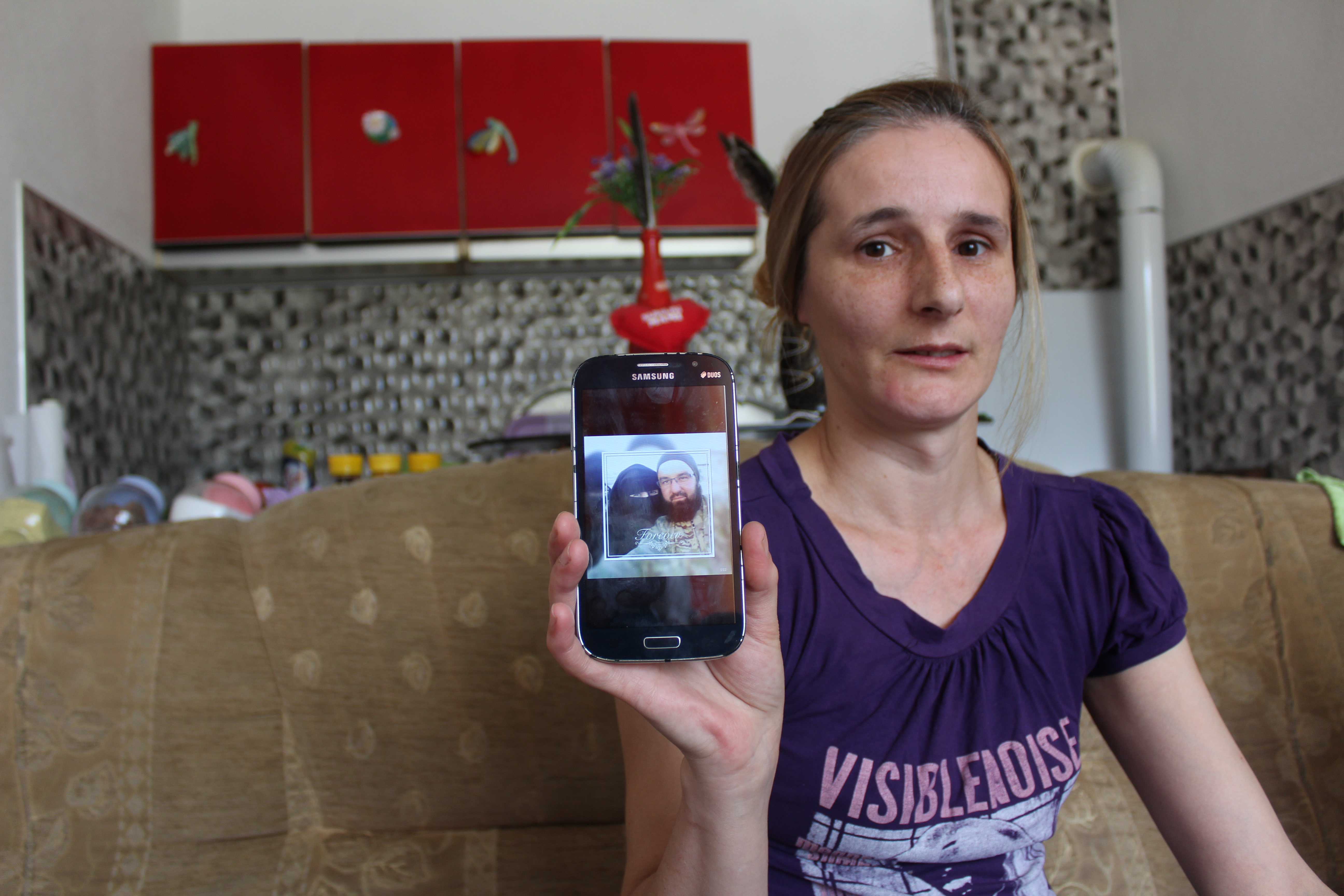 Alema Dolamić shows a photo of her sister in Roj Camp. Image courtesy of Asim Bešlija. Bosnia, 2018. Alema Dolamić shows a photo of her sister in Roj Camp. Image courtesy of Asim Bešlija. Bosnia, 2018.