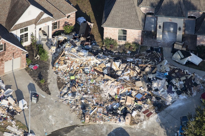 Hurricane Harvey is expected to be the costliest natural disaster in U.S. history. Thousands of homes were flooded, many requiring major repairs. Here debris piles await removal from gutting two homes in Northwest Forest, a subdivisions of Beaumont. Image by Dan Grossman. United States, 2017. Hurricane Harvey is expected to be the costliest natural disaster in U.S. history. Thousands of homes were flooded, many requiring major repairs. Here debris piles await removal from gutting two homes in Northwest Forest, a subdivisions of Beaumont. Image by Dan Grossman. United States, 2017.