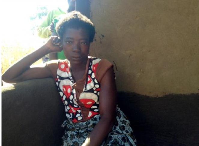 Sakaniza Chipote, 20, is the head of a household of five and receives 4400 kwacha, slightly less than US $14, a month through a social cash transfer program in Malawi. Kerstin Egenhofer, the 2013 Boston University public health student fellow, focused on the program for her international reporting project. Image by Kerstin Egenhofer. Malawi, 2013. Media file: sakanizachipote-malawicashtransfers.jpg