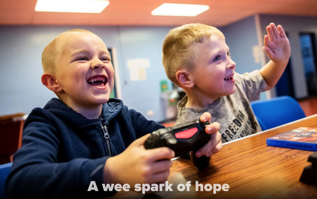 Kyle Hamilton, 7, left, and Lucas Barpon, 7, both of Possilpark, play a wrestling video game on a Playstation during a Young People's Futures session, Oct. 25, 2019, at Possilpoint Community Centre in Possilpark, Glasgow, Scotland. Image by Michael Santiago. United Kingdom, 2019. Kyle Hamilton, 7, left, and Lucas Barpon, 7, both of Possilpark, play a wrestling video game on a Playstation during a Young People's Futures session, Oct. 25, 2019, at Possilpoint Community Centre in Possilpark, Glasgow, Scotland. Image by Michael Santiago. United Kingdom, 2019.