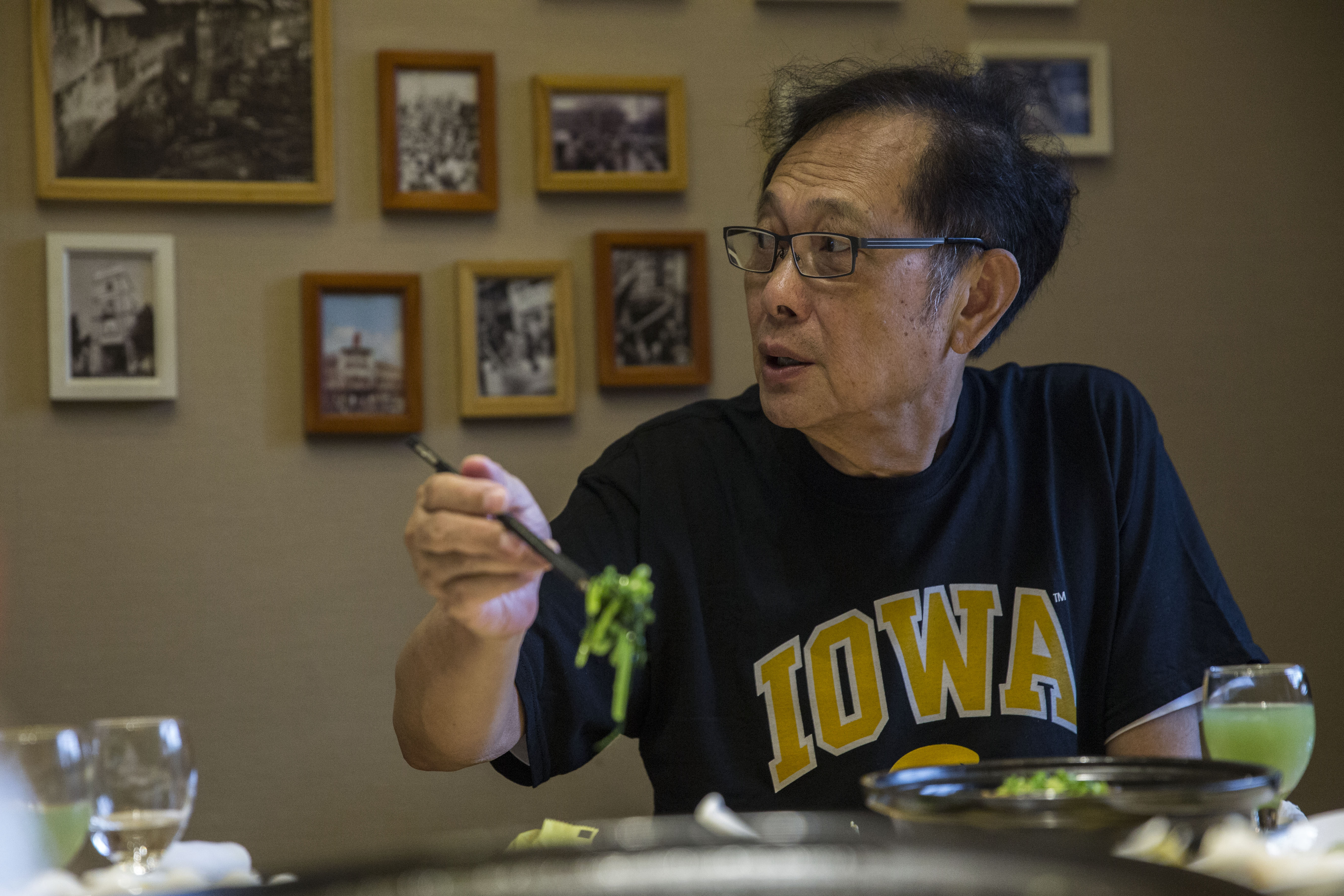 Michael Lee, owner of the Hamburg Inn in Iowa City, eats lunch during a visit to Taizhou, China, on Friday, Sept. 29, 2017. Lee plans to expand his business to China, encompassing both food and education, with headquarters in Taizhou, north of Shanghai. Image by Kelsey Kremer. China, 2017. Michael Lee, owner of the Hamburg Inn in Iowa City, eats lunch during a visit to Taizhou, China, on Friday, Sept. 29, 2017. Lee plans to expand his business to China, encompassing both food and education, with headquarters in Taizhou, north of Shanghai. Image by Kelsey Kremer. China, 2017.