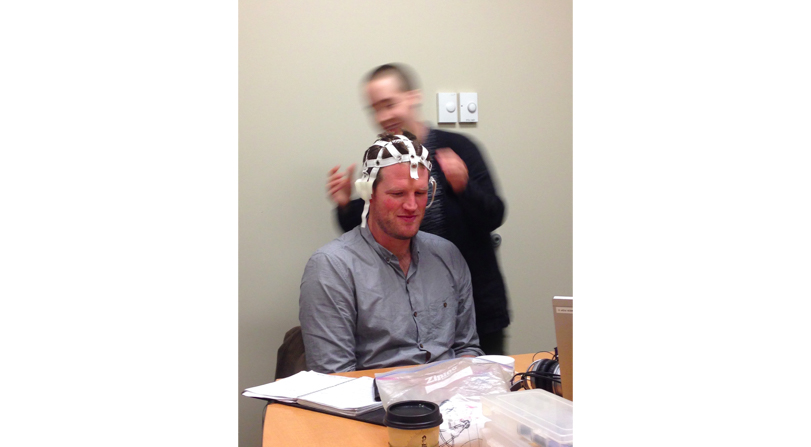 Erik Vance prepares to have his brain scanned while attempting to create a hypnosis-like trance in his mind. Image by Liz Neely. Seattle, WA, 2016. Media file: erikvance_ferris.jpg