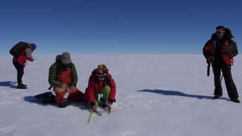 Scientists take measurements on the surface of the Greenland ice sheet. Image by Eli Kintisch. Greenland, 2016. Scientists take measurements on the surface of the Greenland ice sheet. Image by Eli Kintisch.
