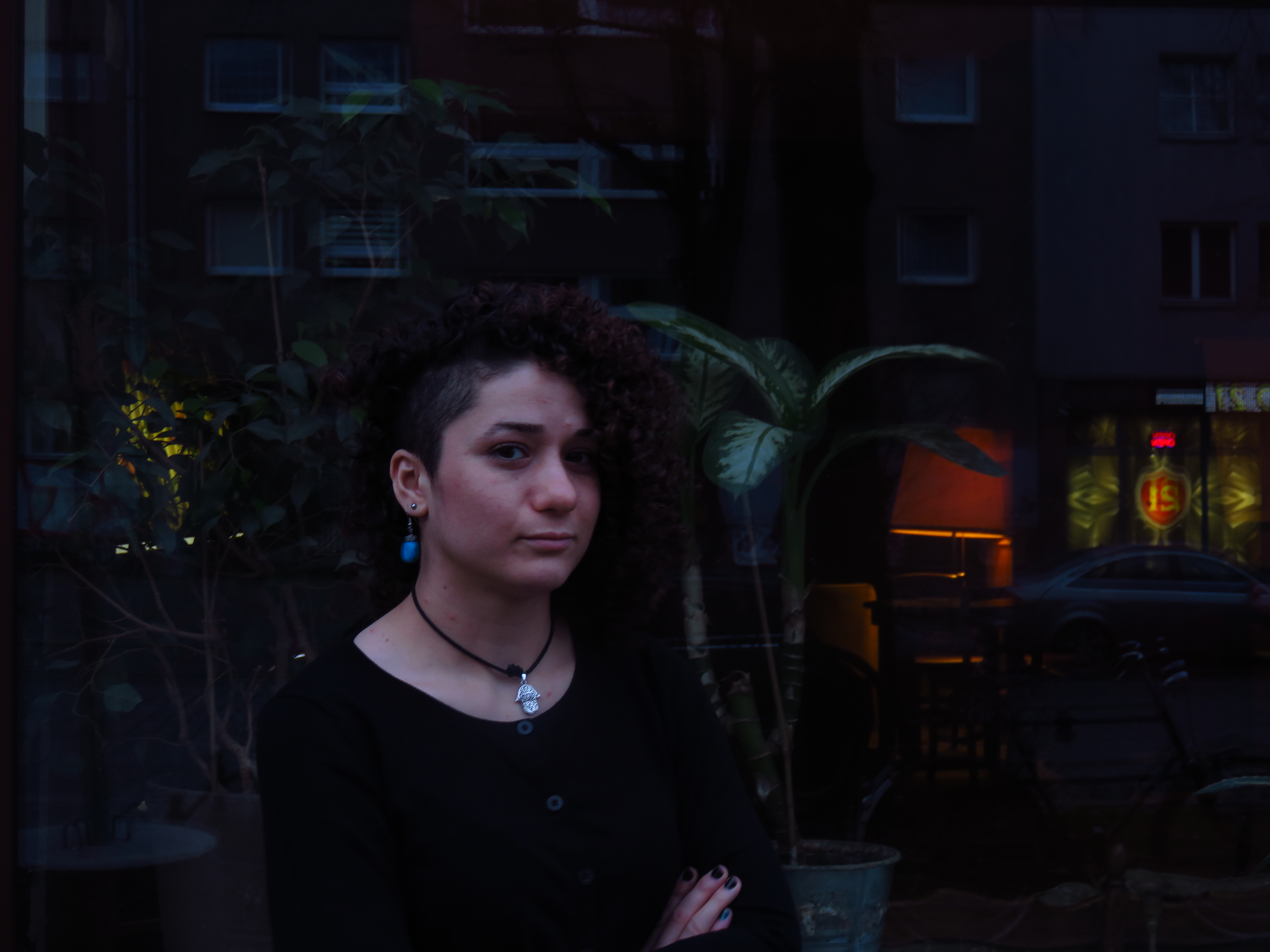 Roshak, a Kurdish-Syrian refugee, poses in front of a trendy cafe in Berlin's Kreuzberg neighborhood. Image by Laura Kasinof. Berlin, 2016. Roshak, a Kurdish-Syrian refugee, poses in front of a trendy cafe in Berlin's Kreuzberg neighborhood. Image by Laura Kasinof. Berlin, 2016.