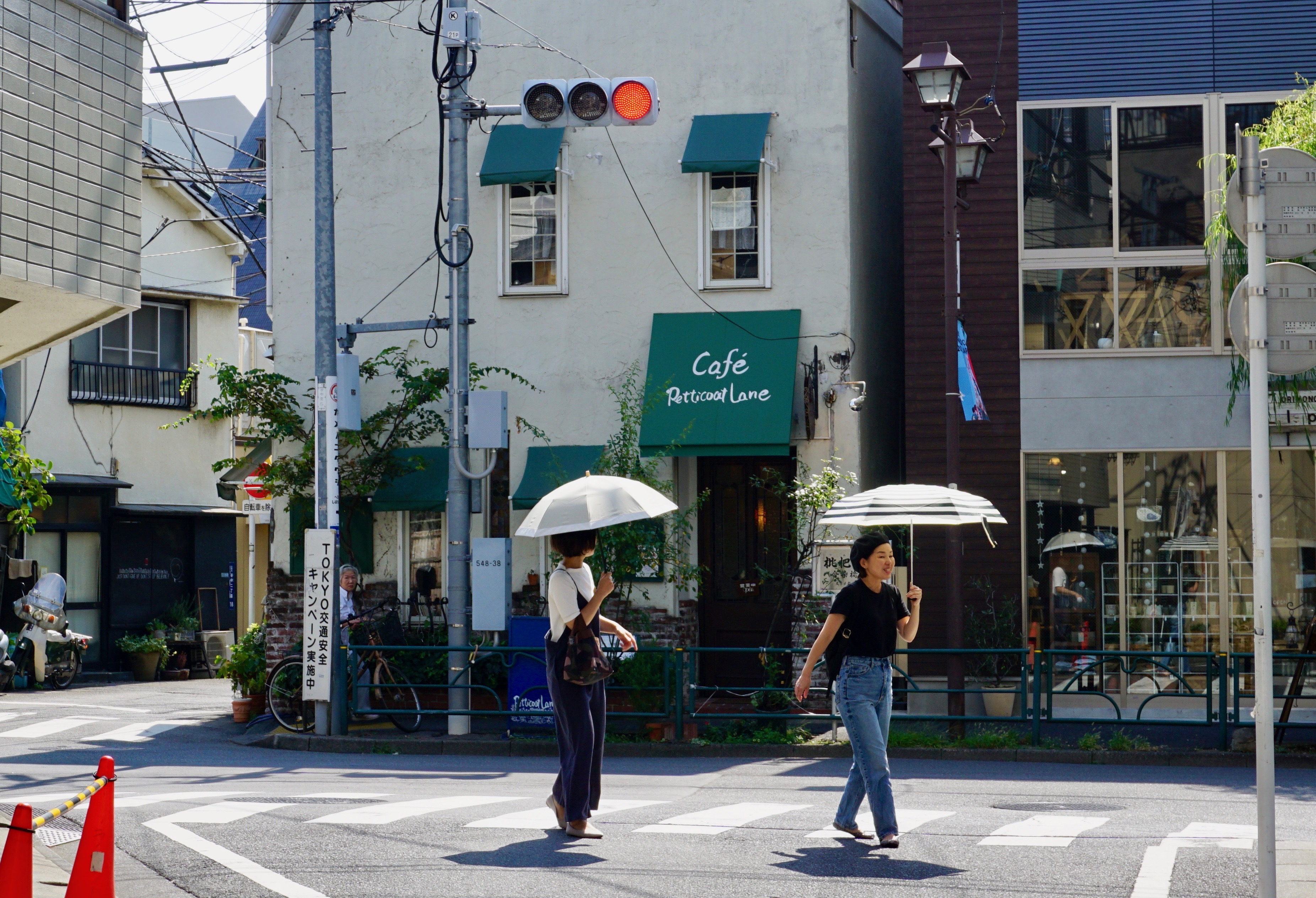 Two women walking in Tokyo with umbrellas. Image by Daniel Merino. Japan, 2019. Two women walking in Tokyo with umbrellas. Image by Daniel Merino. Japan, 2019.