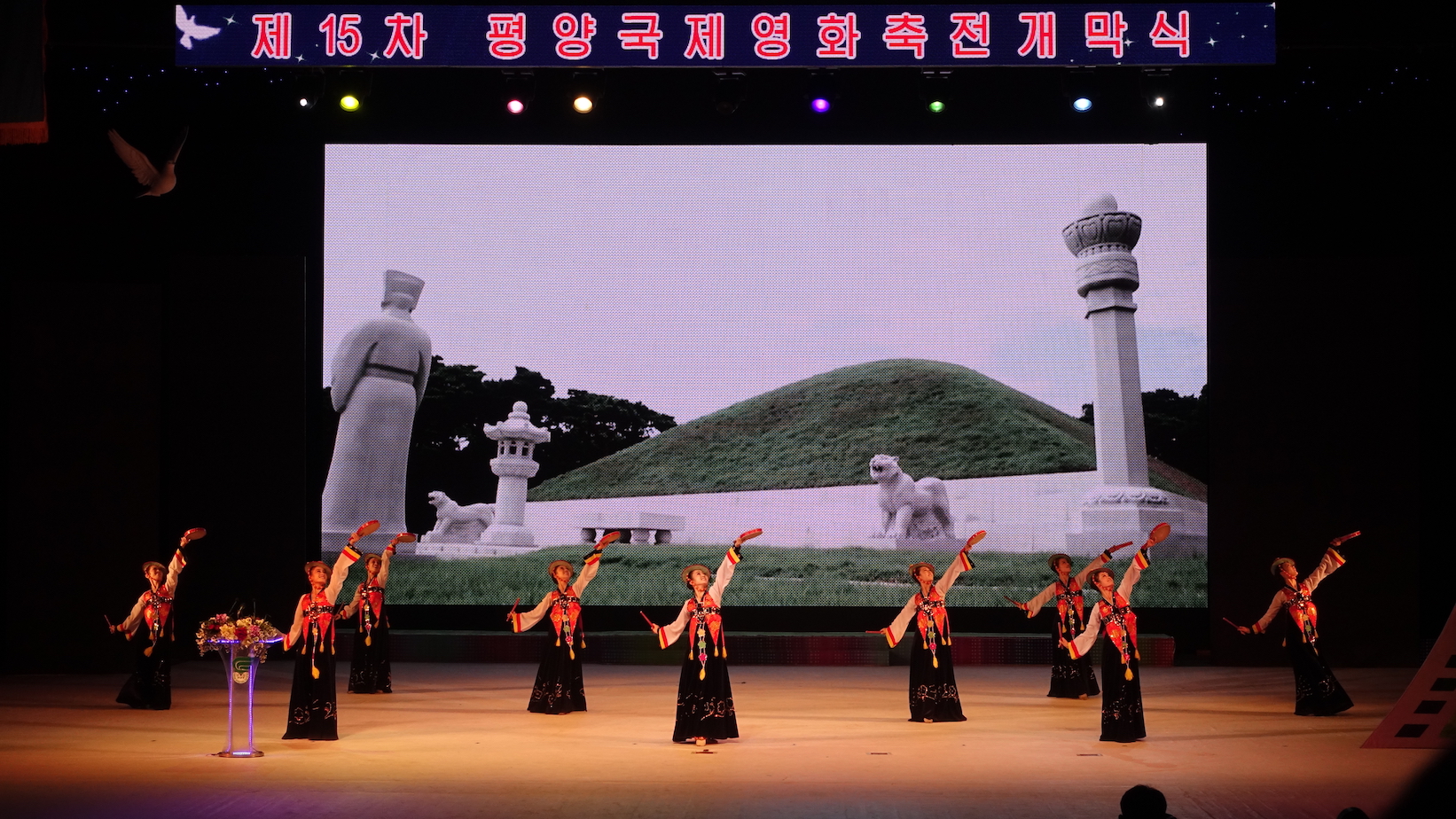 Women dressed in traditional Korean dresses performing at the opening ceremony of the 15th Pyongyang International Film Festival. Image by Laya Maheshwari. North Korea, 2016. Women dressed in traditional Korean dresses performing at the opening ceremony of the 15th Pyongyang International Film Festival. Image by Laya Maheshwari. North Korea, 2016.