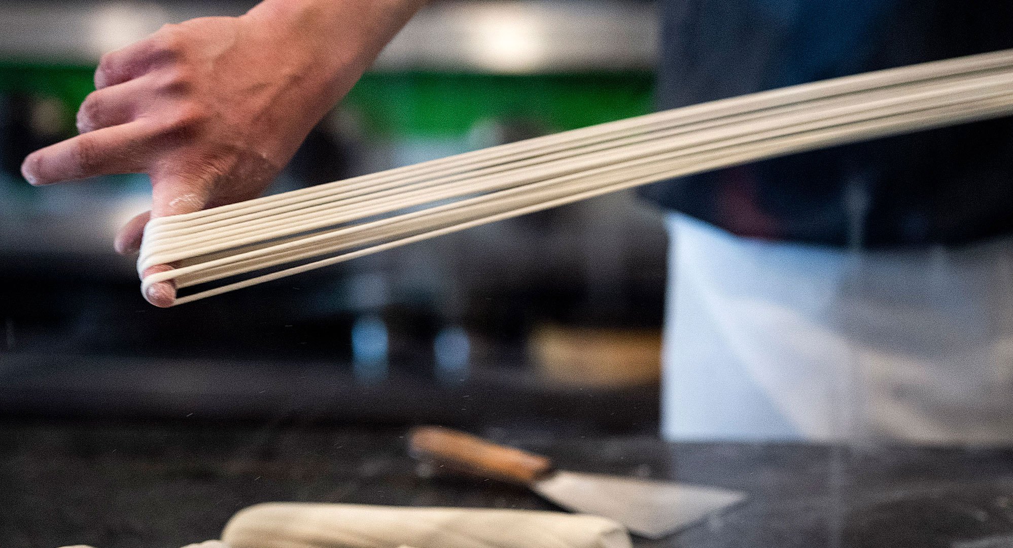 Tony Mao makes hand-pulled noodles at Everyday Noodles. Image by Stephanie Chambers. United States, 2018. Tony Mao makes hand-pulled noodles at Everyday Noodles. Image by Stephanie Chambers. United States, 2018.