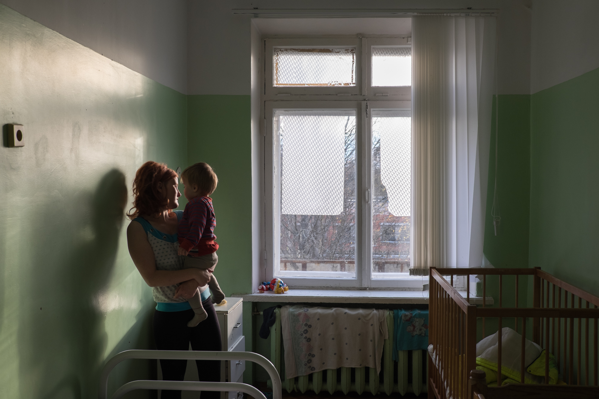 Elena and her son are staying at the hospital as part of a preparation before handing the child to an orphanage. Elena and her son are staying at a hospital before handing the child to an orphanage. Image by Anastasia Rudenko. Russia, 2017.