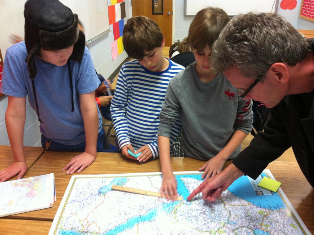 Paul Salopek collaborates with students at Washington International School on walking routes for his Out of Eden project. Media file: img_3673.jpg