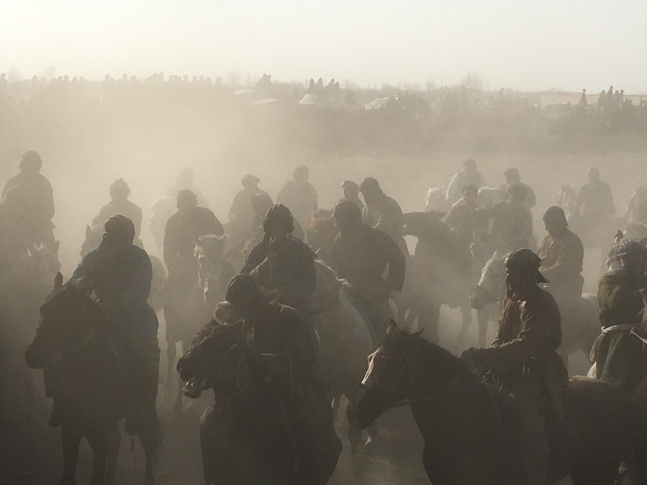 Competitors battle for control of a calf at a buzkashi event in northern Afghanistan. March 2017. Image by Jason Motlagh. Competitors battle for control of a calf at a buzkashi event in northern Afghanistan. March 2017. Image by Jason Motlagh.