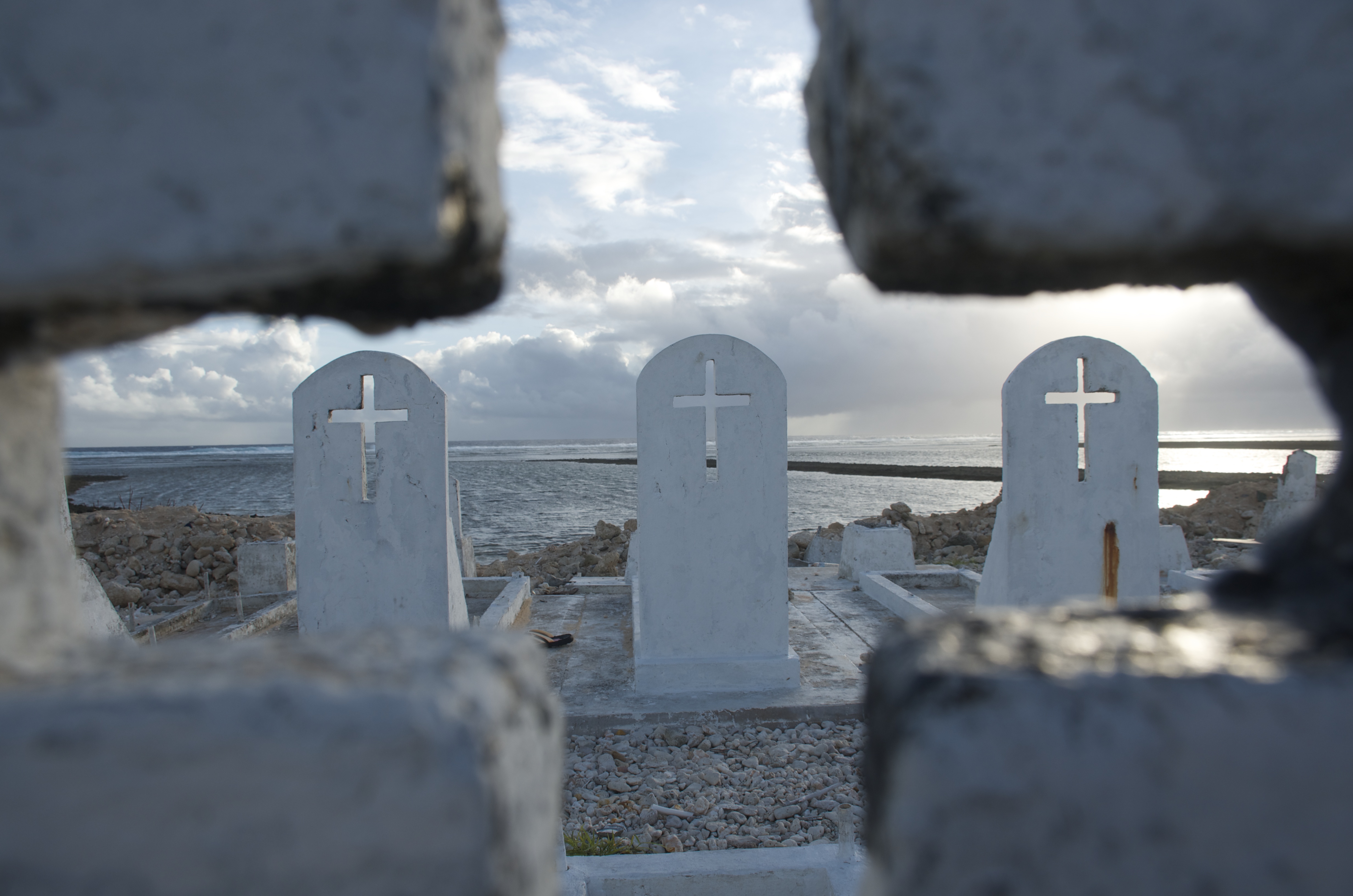 Nearly 70 years ago, the United States used the Marshall Islands for testing nuclear weapons. Now, strong tides blamed on climate change are exhuming graves in the Marshallese capital of Majuro. Image by Dan Zak. The Marshall Islands, 2015. Media file: dsc_0064_1.jpg