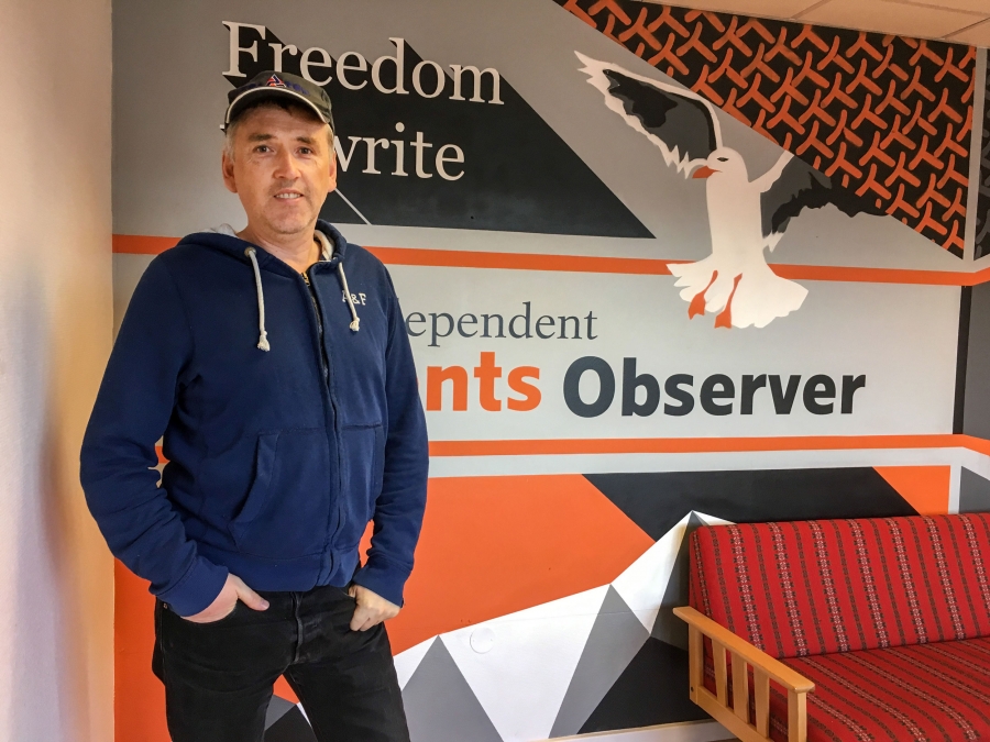 Journalist Thomas Nilsen poses for a photo in the offices of The Barents Observer in Kirkenes, Norway. The newspaper publishes in both English and Russian and covers environmental issues in the Russian Arctic. Nilsen recently found out he was no longer welcome in Russia and he's been fighting the decision in Russian courts. Image by Amy Martin. Norway, 2018. Journalist Thomas Nilsen poses for a photo in the offices of The Barents Observer in Kirkenes, Norway. The newspaper publishes in both English and Russian and covers environmental issues in the Russian Arctic. Nilsen recently found out he was no longer welcome in Russia and he's been fighting the decision in Russian courts. Image by Amy Martin. Norway, 2018.