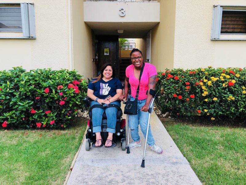 Keishla Rolón (left) and Alexis Smith in front of Keishla's home in Puerto Rico. Image by Kyja Reeves. United States, 2018. Keishla Rolón (left) and Alexis Smith in front of Keishla's home in Puerto Rico. Image by Kyja Reeves. United States, 2018.