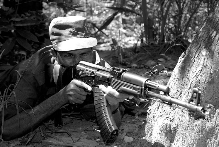 Naxalite guerilla in a training exercise, south Bastar region. The AK-47 pictured was said to have been seized in a recent attack on police forces. Media file: 1128.jpg