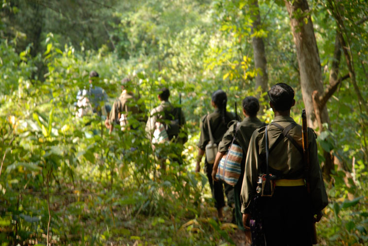 Naxalite guerillas trek back to their jungle redoubt, south Bastar region. Media file: 1137.jpg