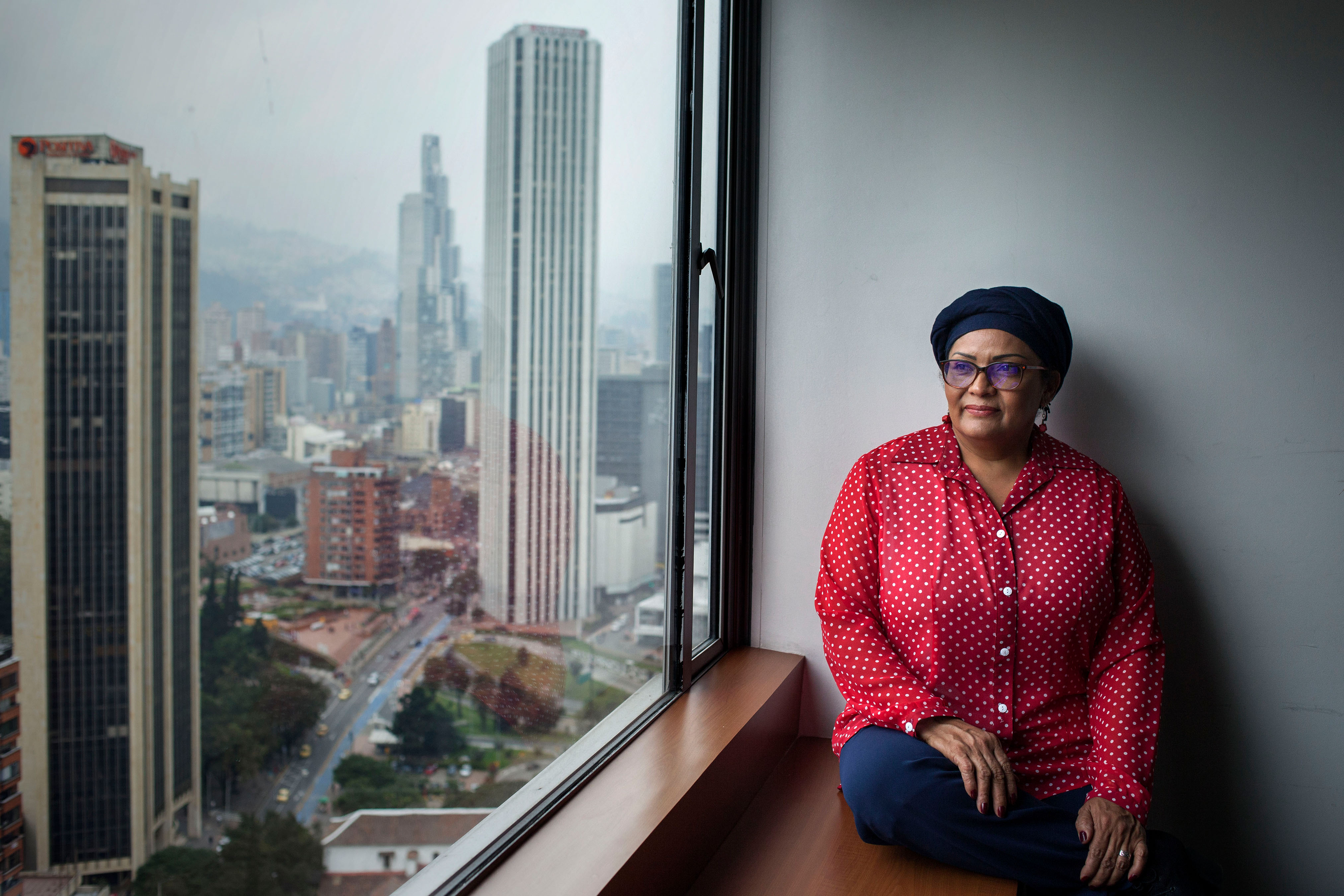 Former FARC-fighter and current Colombian Senator Victoria Sandino poses for a portrait in downtown Bogota, Colombia. The Colombian peace deal signed two years ago has paved the way for ex-rebels like Sandino to take up seats in Congress. Image by Fabio Cuttica. Colombia, 2018. Former FARC-fighter and current Colombian Senator Victoria Sandino poses for a portrait in downtown Bogota, Colombia. The Colombian peace deal signed two years ago has paved the way for ex-rebels like Sandino to take up seats in Congress. Image by Fabio Cuttica. Colombia, 2018.