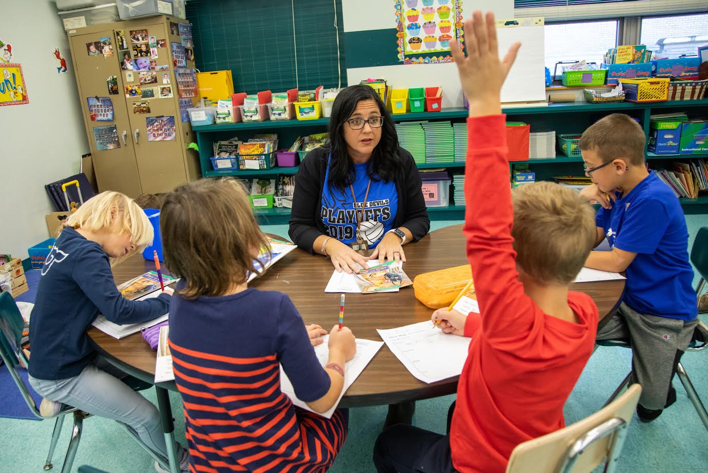 First-grade teacher Niva Vargo works with her students on a reading activity at David Leech Elementary in Leechburg. Image by Andrew Rush. United States, 2019. First-grade teacher Niva Vargo works with her students on a reading activity at David Leech Elementary in Leechburg. Image by Andrew Rush. United States, 2019.