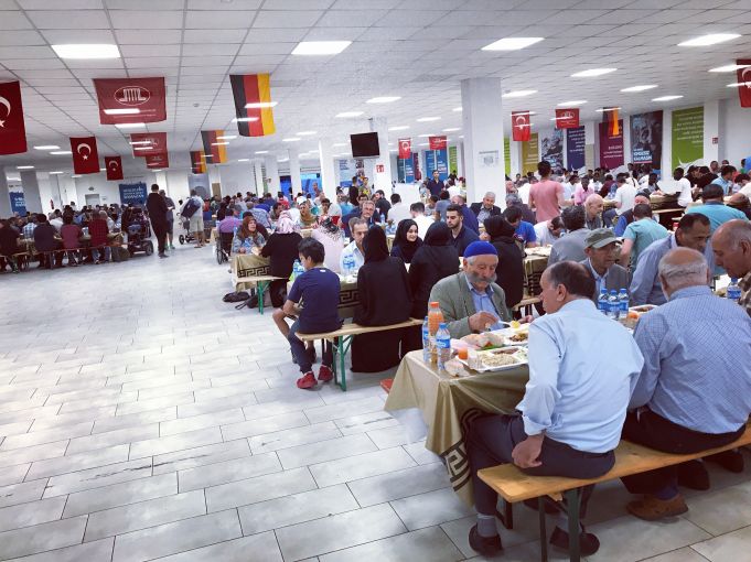 Turkish and German flags decorate a huge iftar held by the Turkish-Islamic Union for Religious Affairs (DITIB), the biggest sponsor and builder of mosques in Germany and a controversial organization for its links with the Turkish government. Image by Alice Su. Germany, 2017.