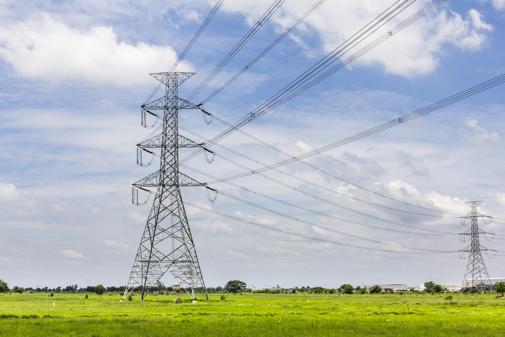 Hi-voltage electrical pylons against blue sky. Image by Happypix / Shutterstock. Hi-voltage electrical pylons against blue sky. Image by Happypix / Shutterstock.