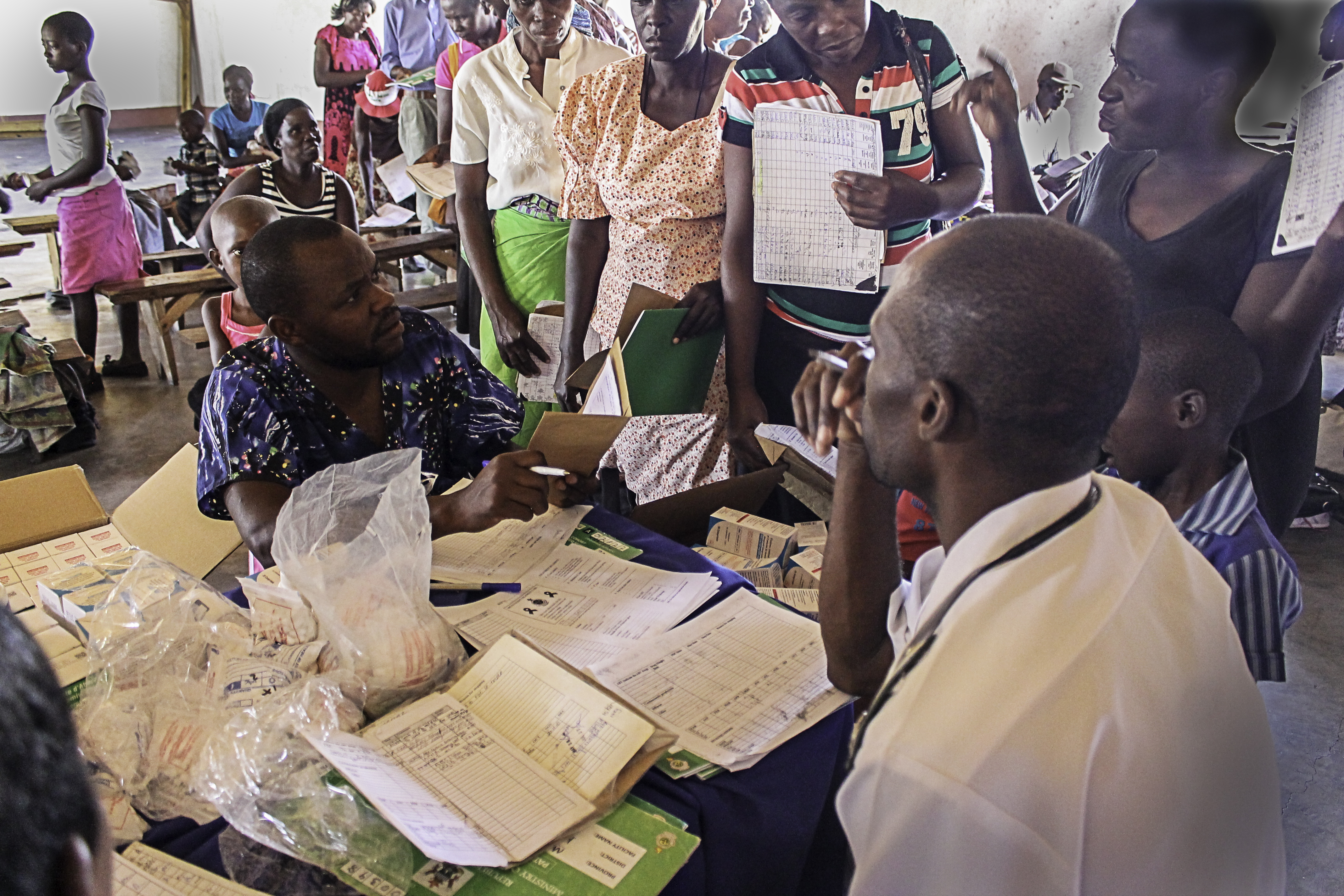 HIV-infected people in a remote Zimbabwean village receive antiretroviral drugs at the localchurch once every 2 months. Image by TJ Maposhere. Zimbabwe, 2015. Media file: img_9649.jpg