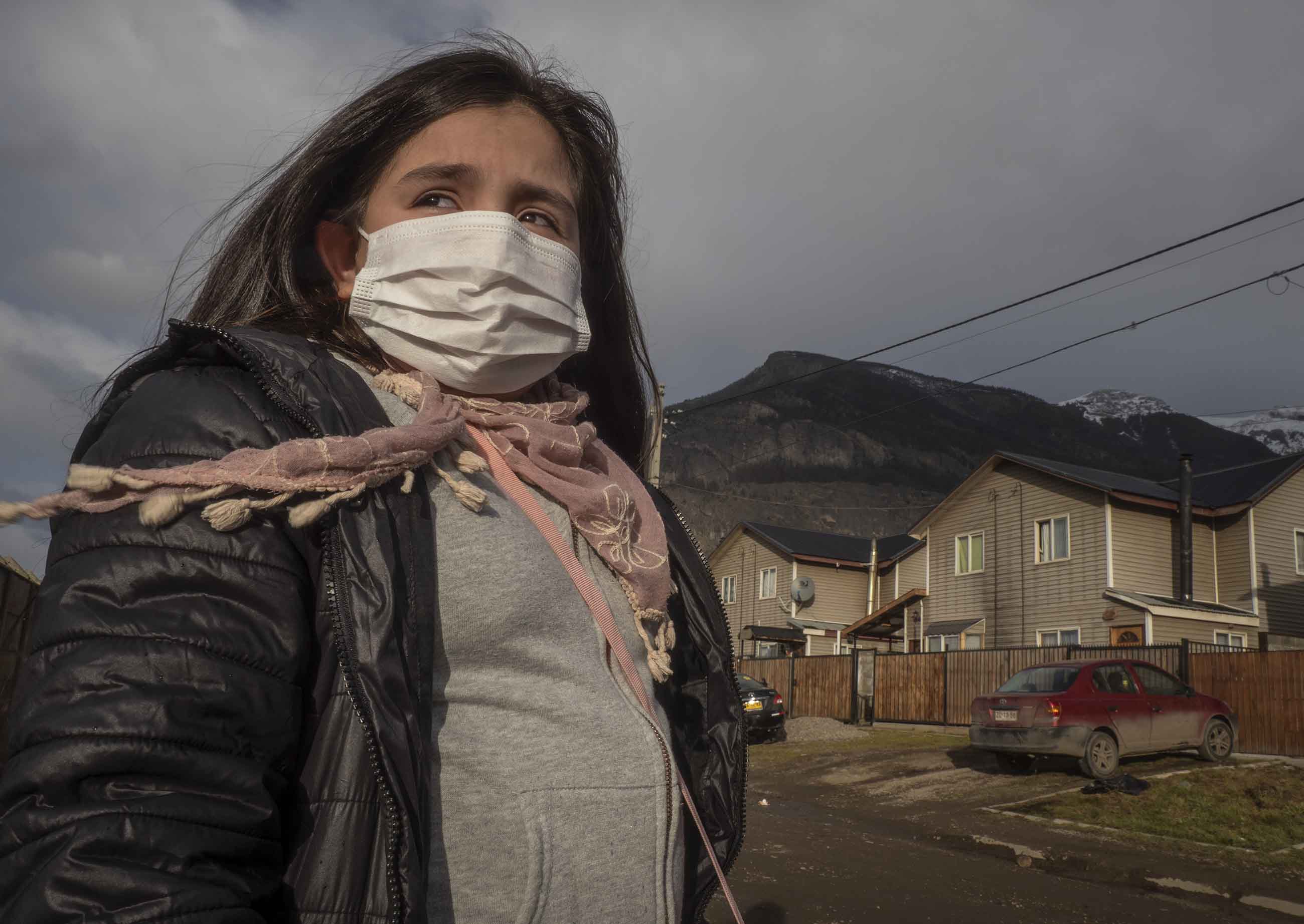 Natalie Galindo, 10, has severe asthma and most trips outside her home in the town of Coyhaique involve wearing a mask — or even a respirator. Image by Larry C. Price. Chile, 2018. Natalie Galindo, 10, has severe asthma and most trips outside her home in the town of Coyhaique involve wearing a mask — or even a respirator. Image by Larry C. Price. Chile, 2018.
